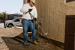 A liquid perimeter treatment around the foundation of a structure is an effective treatment for subterranean termites.